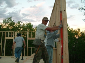 Grandpa makes sure walls are straight
