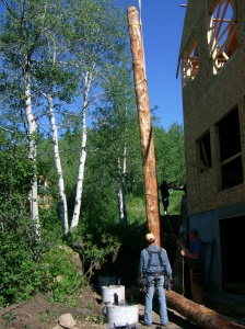 Setting the logs for the roof overhang and double balcony support