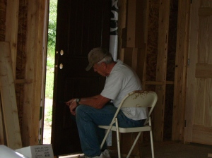 Grandpa putting the finishing touches on the front door seal coat